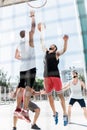 Athletic men playing basketball together on court Royalty Free Stock Photo