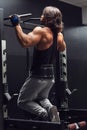 Athletic muscular man doing pull-ups in a gym Royalty Free Stock Photo