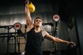 Athletic muscular man with perfect beautiful body wearing sportswear lifting heavy free weights Royalty Free Stock Photo