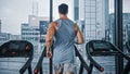 Athletic Muscular Man Running on a Treadmill, Leg and Cardio Day. Strong Man Training in the Modern Royalty Free Stock Photo