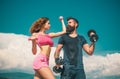 Athletic people. Young sporty sexy couple showing muscle and workout outside. Royalty Free Stock Photo