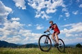 Athletic professional sportsman cyclist in sportswear and helmet cycling cross country bike Royalty Free Stock Photo