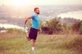 Athletic runner doing stretching exercise