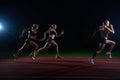 Athletic runners passing baton in relay race Royalty Free Stock Photo