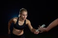 Athletic runners passing baton in relay race Royalty Free Stock Photo