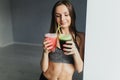 Athletic and girl drinking healthy smoothies Royalty Free Stock Photo