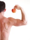 Athletic male body builder holding red apple Royalty Free Stock Photo