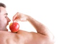 Athletic male body builder holding red apple Royalty Free Stock Photo