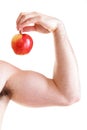 Athletic male body builder holding red apple Royalty Free Stock Photo