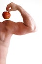 Athletic male body builder holding red apple Royalty Free Stock Photo