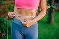 Fitness Woman With Tape Measure Showing Her Waist Royalty Free Stock Photo