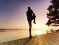 Athletic sport man stretching leg muscles before run Royalty Free Stock Photo