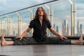 Athletic Sporty Man Doing Straddle Splits Outdoors On Urban Background At Skyscraper Roof. Upavista Konasana Asana Royalty Free Stock Photo