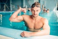 Athletic swimmer shows muscles, aqua sports Royalty Free Stock Photo