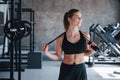 Athletic type of body. Photo of gorgeous blonde woman in the gym at her weekend time