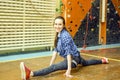 Athletic woman climbing indoors, view from the back Royalty Free Stock Photo