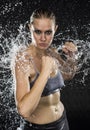 Athletic Woman in Combat Pose in Water Splashes