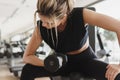 Athletic woman doing bicep curl exercise with a dumbbells in the gym Royalty Free Stock Photo