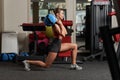 Athletic woman doing lunges with heavy bag Royalty Free Stock Photo