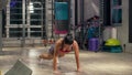 Athletic woman doing push ups