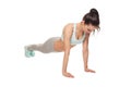 Athletic woman doing push-ups on a white background Royalty Free Stock Photo