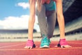 Athletic woman going for a jog or run at running track. Healthy fitness concept with active lifestyle. instagram filter