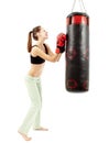 Athletic woman having fun and pulling faces to a punching bag Royalty Free Stock Photo