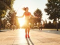 Athletic woman with jumping rope training in park Royalty Free Stock Photo