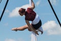 Athletic Woman Performs Aerial Gymnastics With Silks At Fall Festival