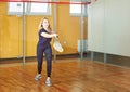 Athletic woman playing squash Royalty Free Stock Photo