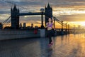 Athletic woman running in front of the urban skyline of London Royalty Free Stock Photo