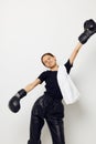 athletic woman with towel boxing black gloves posing sports isolated background