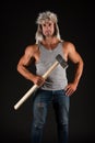 Athletic worker hold hammer tool in strong arms biceps triceps in casual wear black background, miner