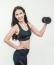 Athletic young asian woman showing biceps Royalty Free Stock Photo