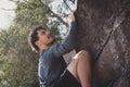 Athletic young man climbing rock mountain outdoors Royalty Free Stock Photo