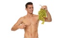 Athletic young man with in grapes