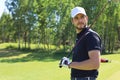 Athletic young man playing golf in golfclub Royalty Free Stock Photo