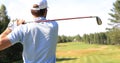 Athletic young man playing golf in golfclub Royalty Free Stock Photo