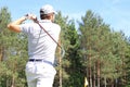 Athletic young man playing golf in golfclub Royalty Free Stock Photo