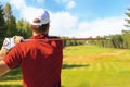 Athletic young man playing golf in golfclub. Royalty Free Stock Photo