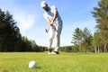 Athletic young man playing golf in golfclub Royalty Free Stock Photo