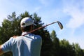 Athletic young man playing golf in golfclub Royalty Free Stock Photo