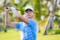 Athletic young man playing golf Royalty Free Stock Photo