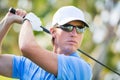 Athletic young man playing golf Royalty Free Stock Photo