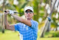 Athletic young man playing golf Royalty Free Stock Photo