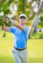 Athletic young man playing golf Royalty Free Stock Photo
