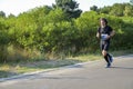 Athletic young man running in the nature. Urban healthy active lifestyle