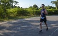 Athletic young man running in the nature. Urban healthy active lifestyle