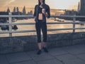 Athletic young woman with cup in London at sunrise Royalty Free Stock Photo