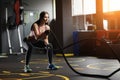 Athletic young woman doing crossfit exercises with a rope. Royalty Free Stock Photo